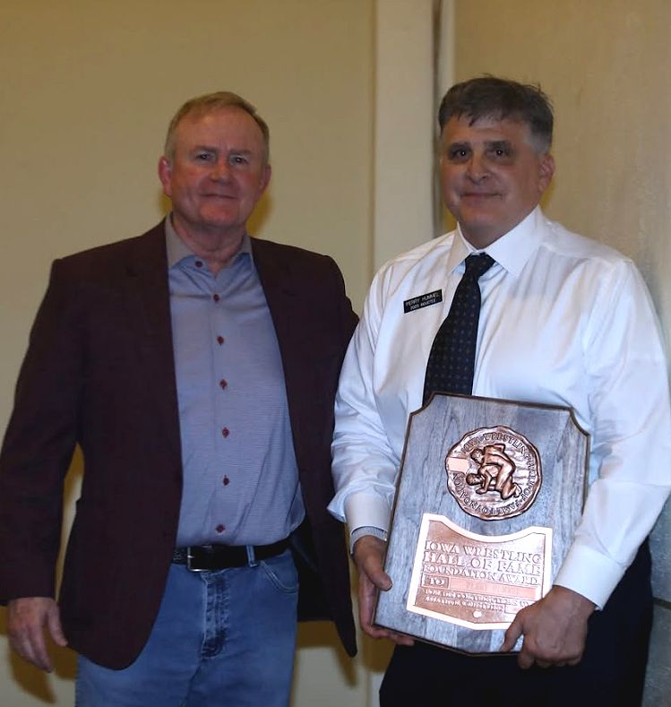 Perry Hummel Jim Gibbons Accepting Plaque At IWHOF Banquet Apr 14, 2025 Perry Hummel Gallery Photos
